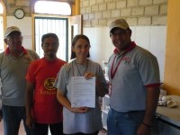 Dada Atmapranananda and Didi Ananda Sadhana receive award of excellence for Centro Madre, Barlovento, Venezuela from two officials of Venezualan CIARA